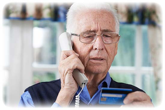 Dad giving credit card information to a scammer.